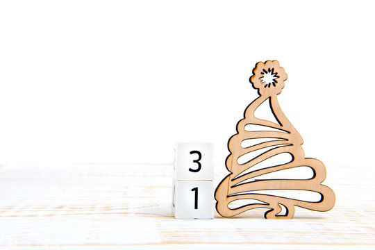 Day 31th of month, calendar on white background with wooden christmas tree. Winter time. Empty space for text.