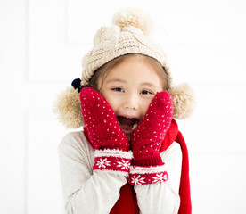 happy little girl in winter clothes.