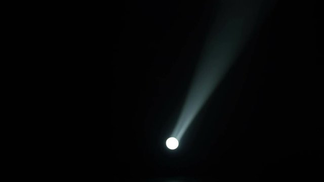 Realistic footage of stage light flashing rays spotlights through smoke. Great as a natural stage background for different projects!!!