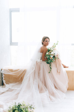beautiful bride in a luxurious dress in eco-style