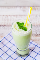 a glass of green tea smoothie