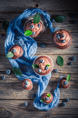 Sweet brown cupcake made of fresh berries and cream
