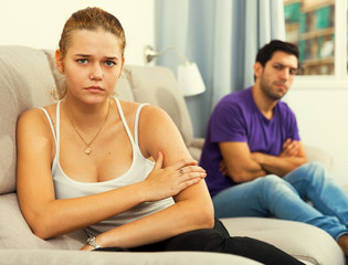 Woman on sofa after quarrel with husband