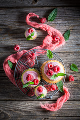 Obraz na płótnie Canvas Delicious raspberry cupcake made of cream and fruits