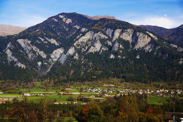 Italian Alps in autumn, stunning views of the background of the small town