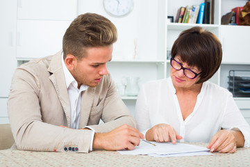 Man consults at the familiar mature lawyer