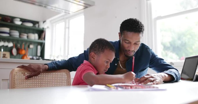 Father helping Son with school work