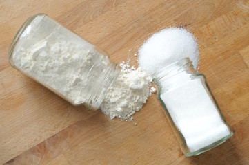 sugar and flour spilled on the kitchen  table