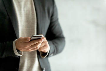 Businessman Typing on smart phone