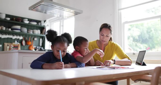 Children learning how to write alphabet