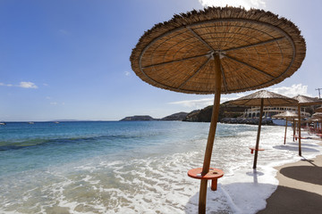 High tide on beach with manipulated parasol © Peter de Kievith