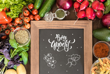 chalkboard with group of fresh vegetables