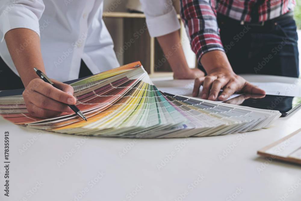 Poster two young women interior design or graphic designer working on project of architecture drawing with 