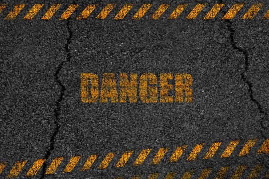 Asphalt background texture danger with some fine grain with crack road