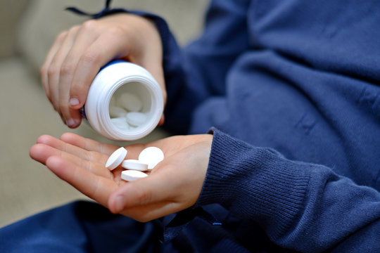 Small Child Taking Medicine