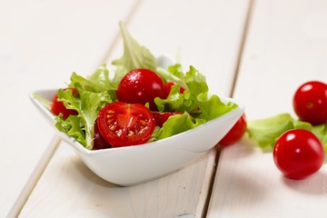 Small bowl of lettuce and tomato salad