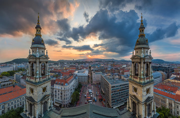 Fototapeta premium Budapest, Hungary - Panoramic skyline view of Budapest from the top of Saint Stephens Basilica aka Szent Istvan Bazilika at sunset with amazing sky and clouds