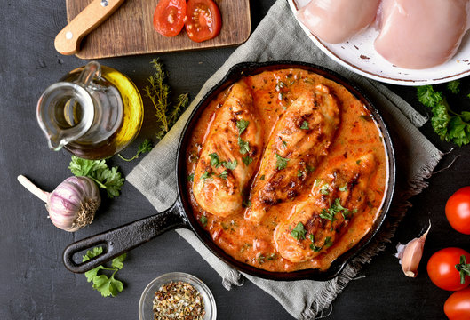 Cooked chicken breast with tomato sauce
