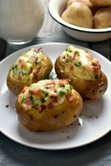 Stuffed potato with bacon, cheese and green onion