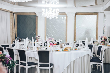 the restaurant, set tables with white table cloths