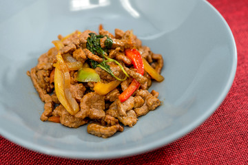 wok fried chicken stir fry with sweet peppers and chinese vegetables