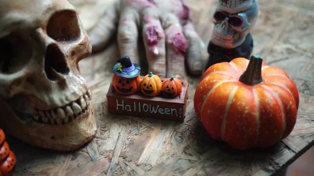 Halloween day footage with skull, pumpkin, candle light, and movement