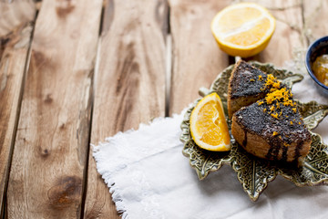 pie with poppy and orange for breakfast, on a wooden background