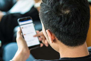 Close up Businessman using his Mobile Phone outdoor. business concept, technology concept.