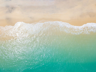 Beach top view with wave foam