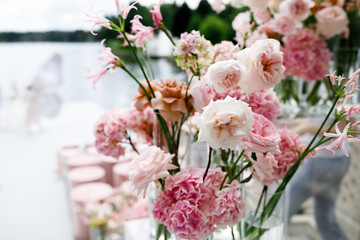 Tender pink peonies in the glass vase