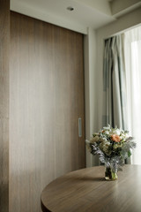 Wedding bouquet stands on the table in bright room