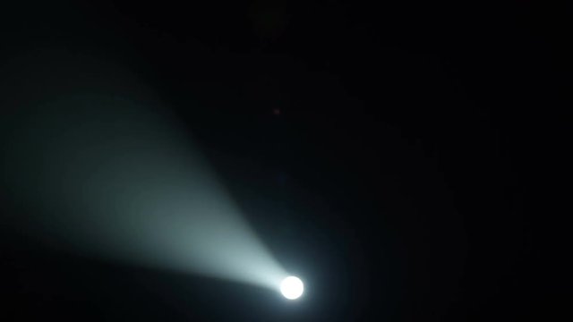 Realistic footage of stage light flashing rays spotlights through smoke. Great as a natural stage background for different projects!!!