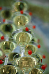 Martini glasses with red cherries