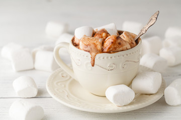 cup of cocao with marshmallow on white