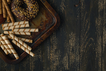 lot of baked goods and sweets on a dark table