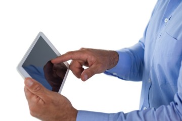 Mid section of businessman using tablet computer