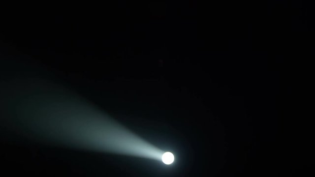 Realistic footage of stage light flashing rays spotlights through smoke. Great as a natural stage background for different projects!!!