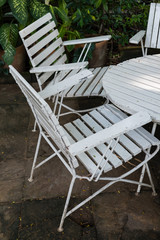 white wood garden chairs and table
