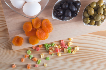 Olives, eggs, juice and other products on the table, healthy meals
