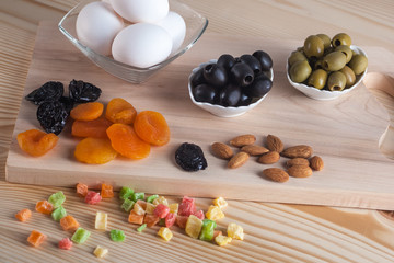 Olives, eggs, juice and other products on the table, healthy meals