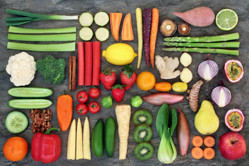 Super food for good health concept with fresh vegetables and fruit, nuts and spices with foods high...