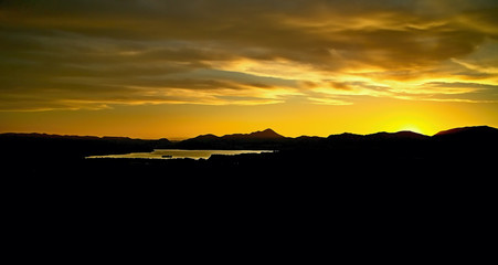 A beautiful colorful sky over the Liptovska Mara dam at sunset.