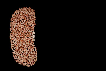 A lot of beige beans on a black background.
