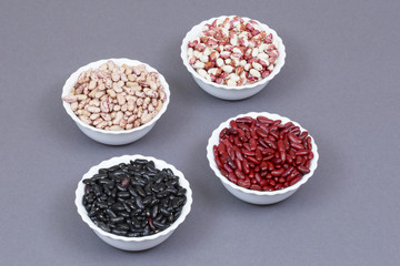 Beans of different colors on plates.