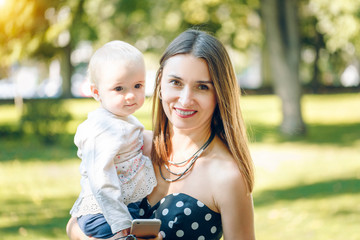 mother with child outside on a summer day