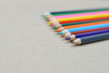 Colored pencils on a wooden board