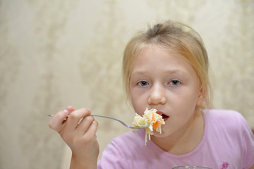 little girl eats cabbage