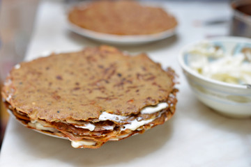 Pie of beef liver. Focus on the middle hepatic pie. Tomato, liver, onion, carrot and garlic, eggs are part of the recipe of the meat dishes.