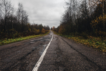 Old broken asphalt during late autumn