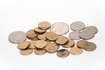Various coins of American currency isolated against a white background.